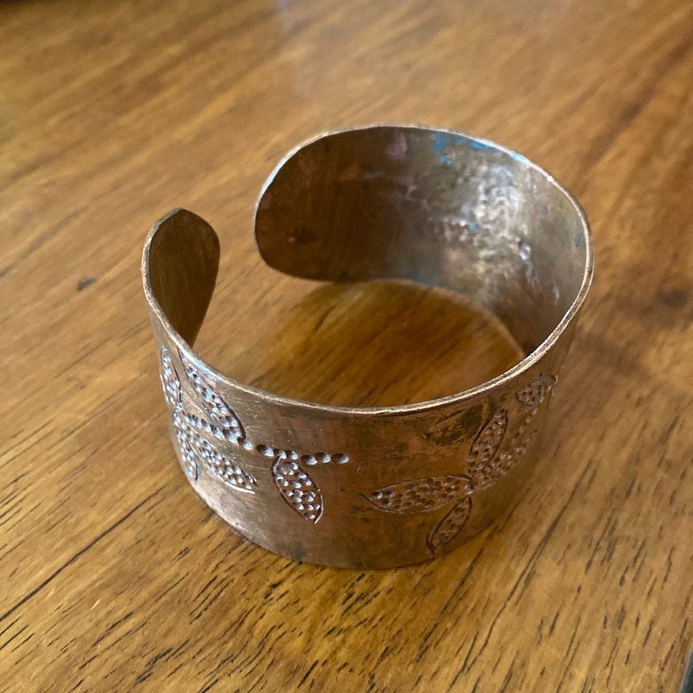 Copper cuff bracelet with engraved flower decals